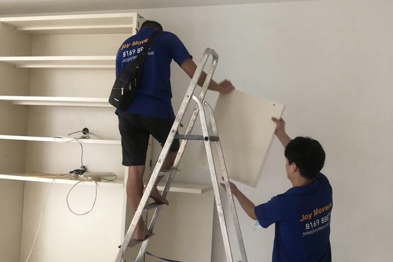 workers assembling a shelf