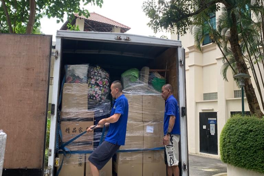 loading storage boxes into moving truck